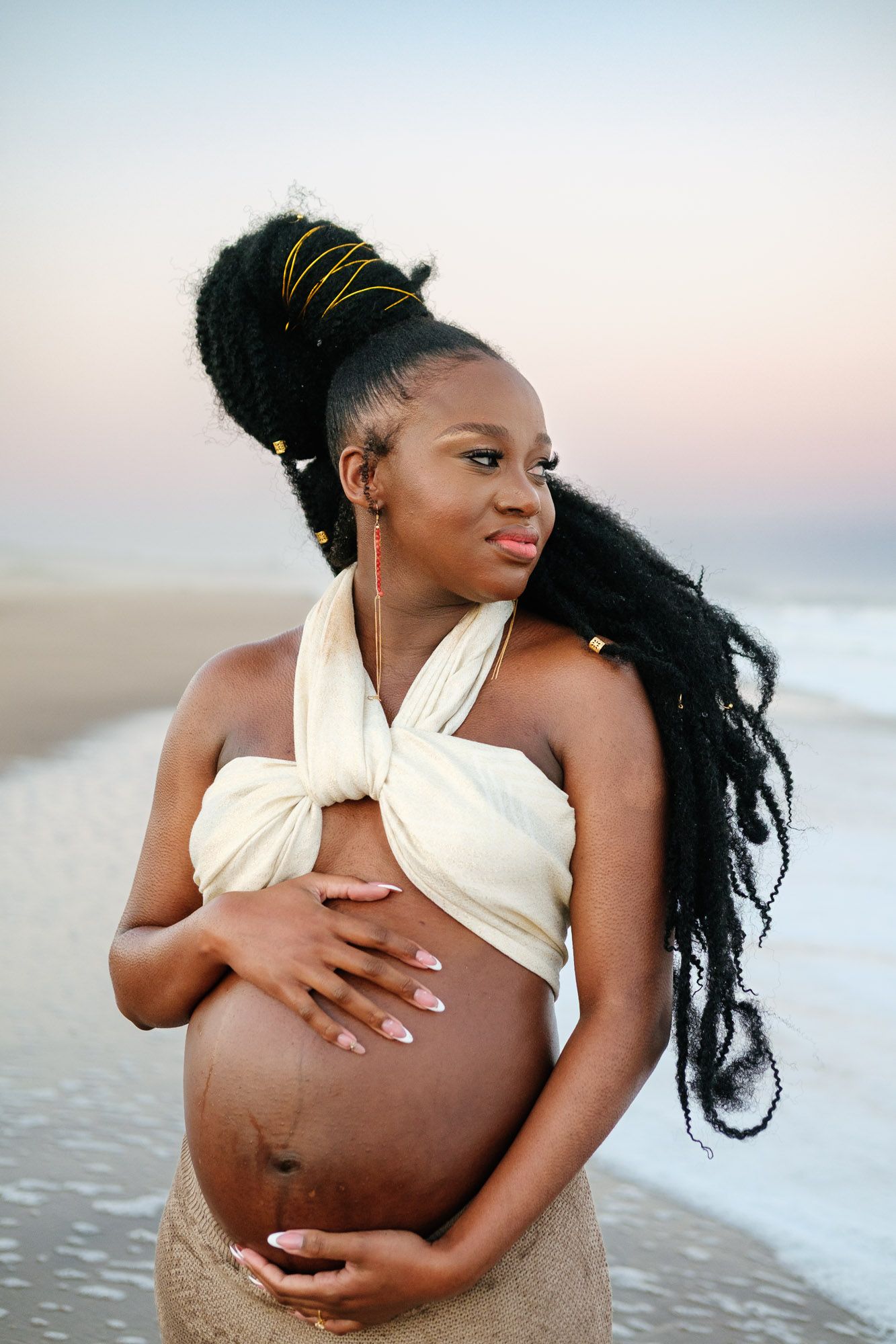 Maternity portrait capturing love and anticipation before her daughter arrives