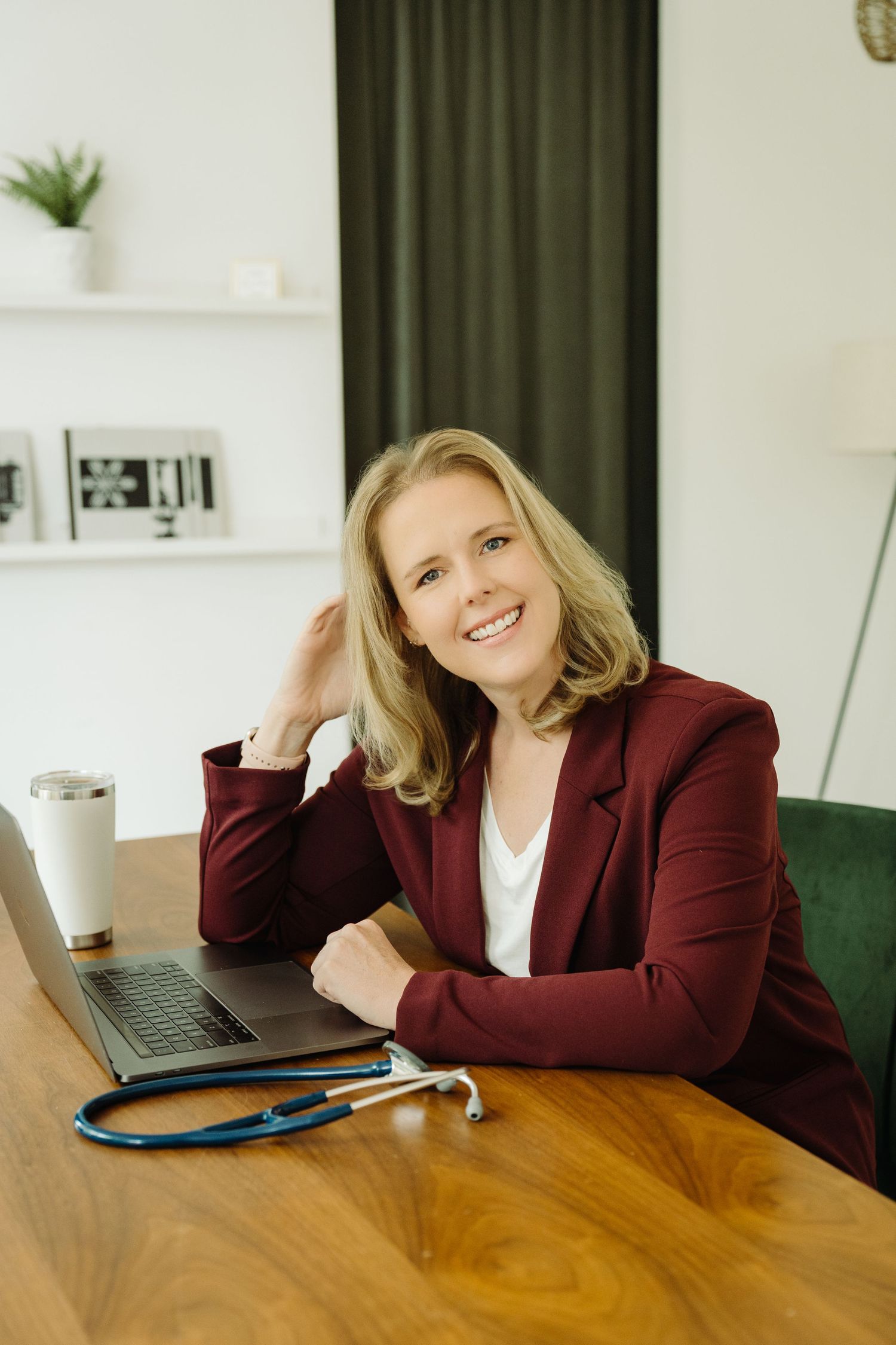 Small business owner working at a laptop during a branding photoshoot
