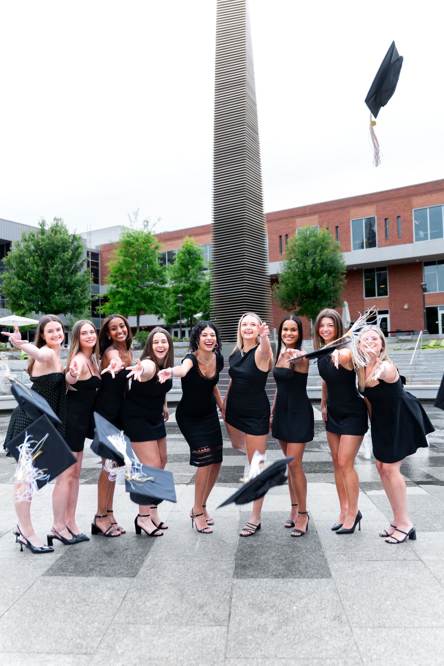 group grad photos at Georgia Tech during a cloudy day by atlanta graduation photograher Pierre