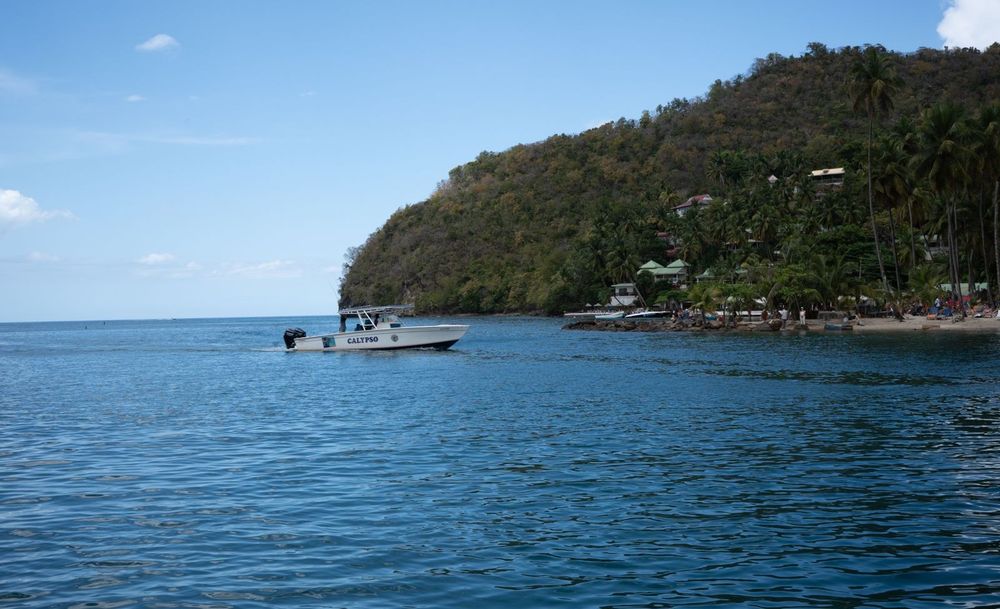 Lush green tropical peninsula meets the deep blue Caribbean Sea in St. Lucia.