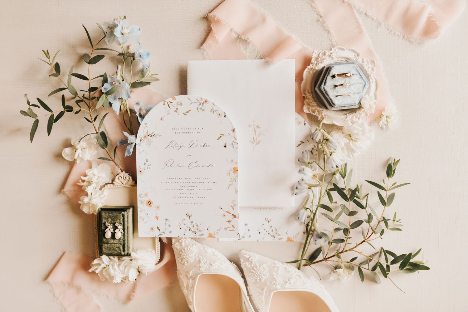 Elegant wedding stationery and rings photographed by a North Texas wedding photographer