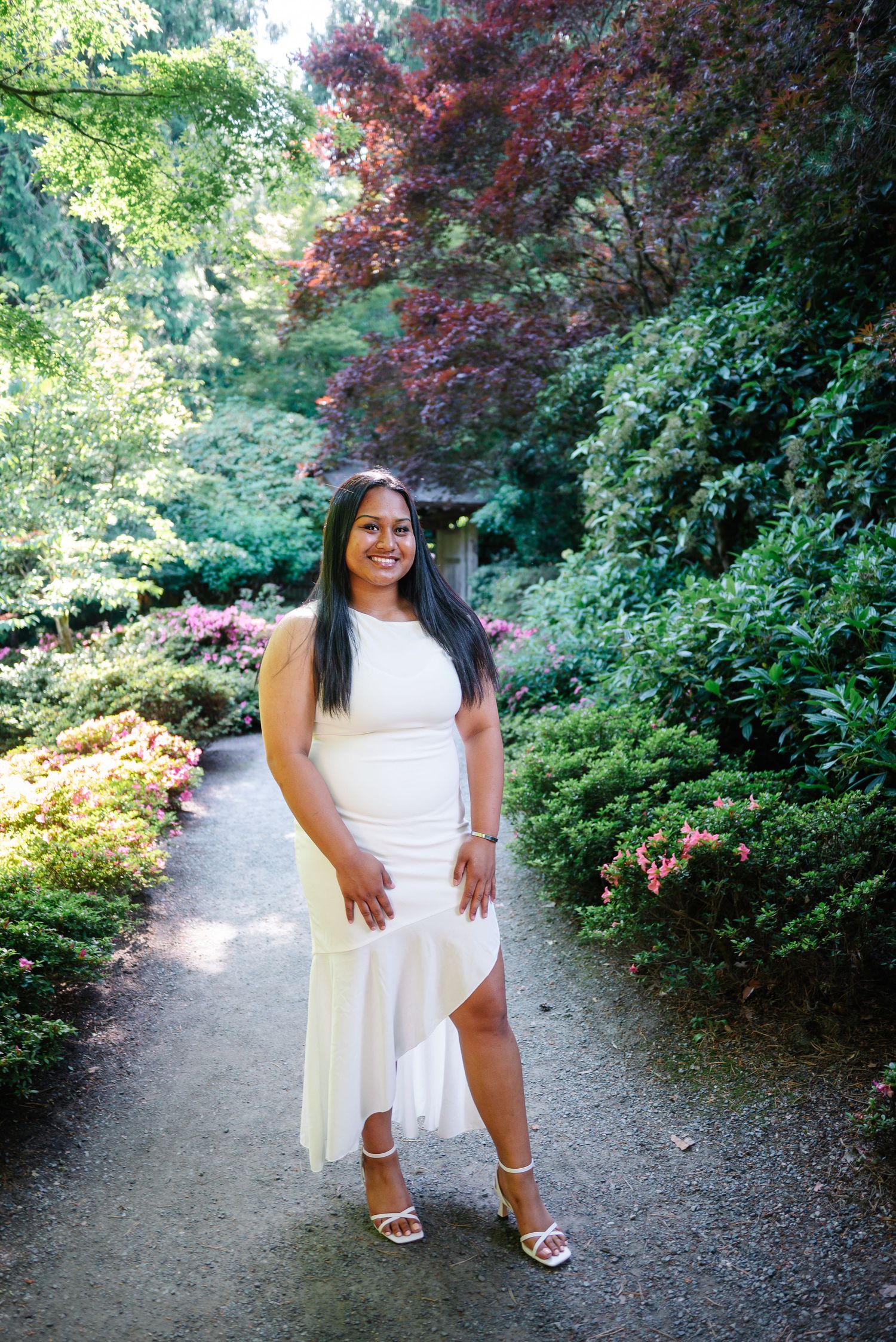 Portrait in a white dress along a lush garden pathway in Bellevue Botanical Garden's Yao Garden