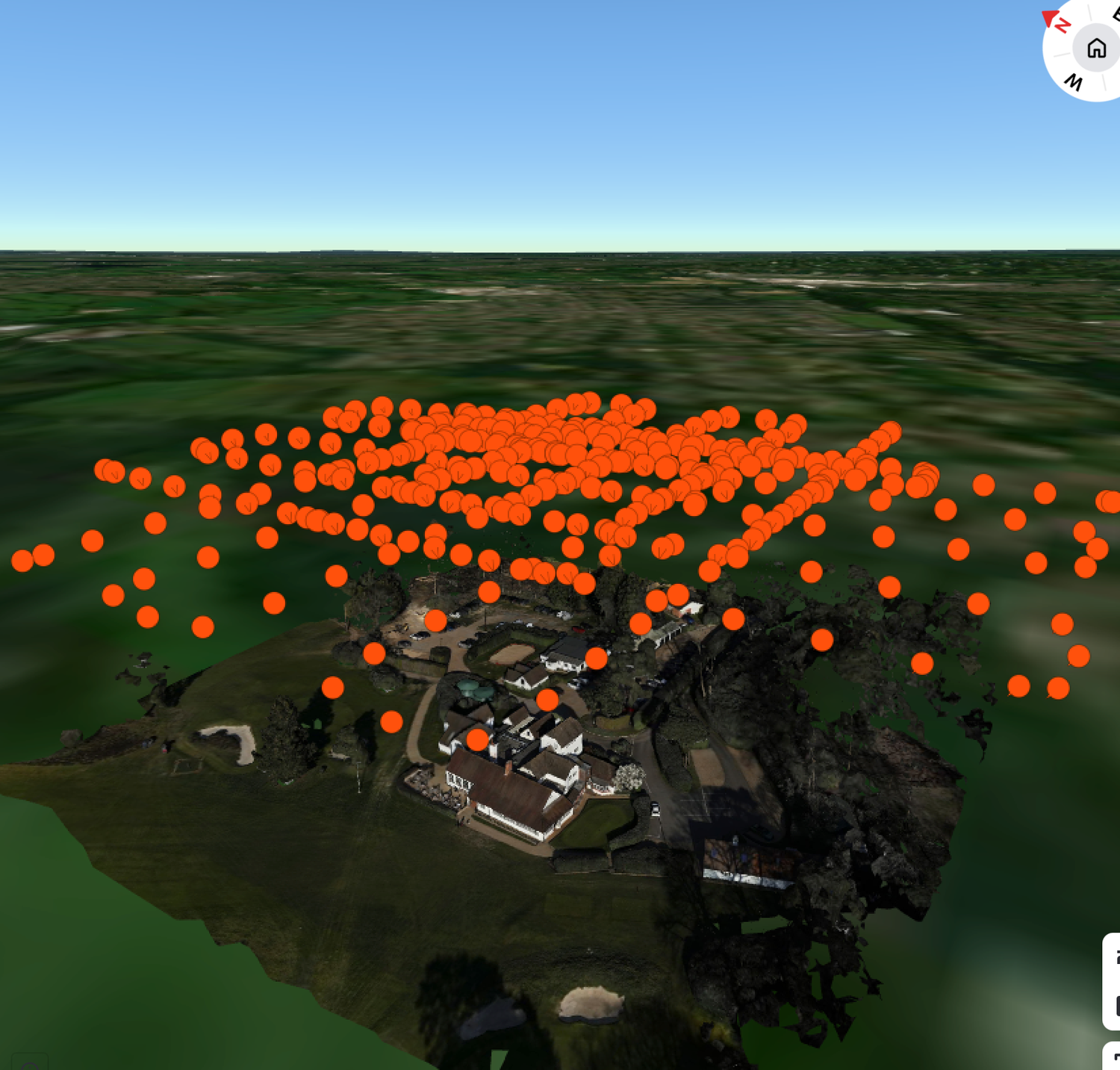 Aerial 3D map view with orange dot markers clustered over a rural property surrounded by green landscape.