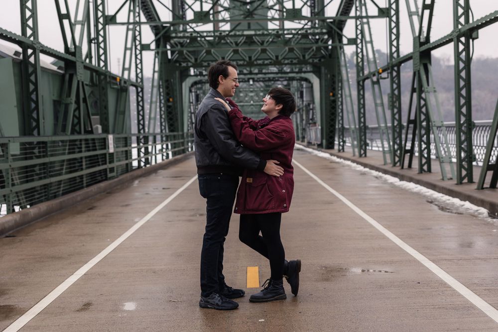 Progressive sequence of a proposal moment on an industrial steel bridge walkway.