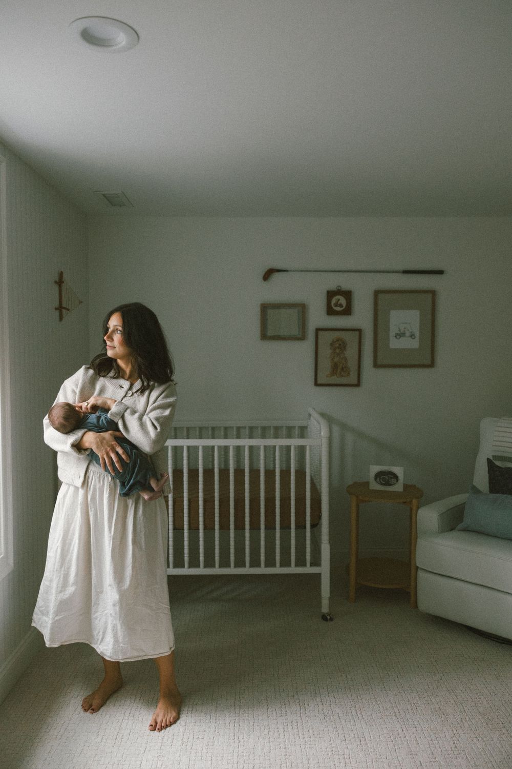 A series of artistic photos showing a woman in white dress dancing in a minimalist room.