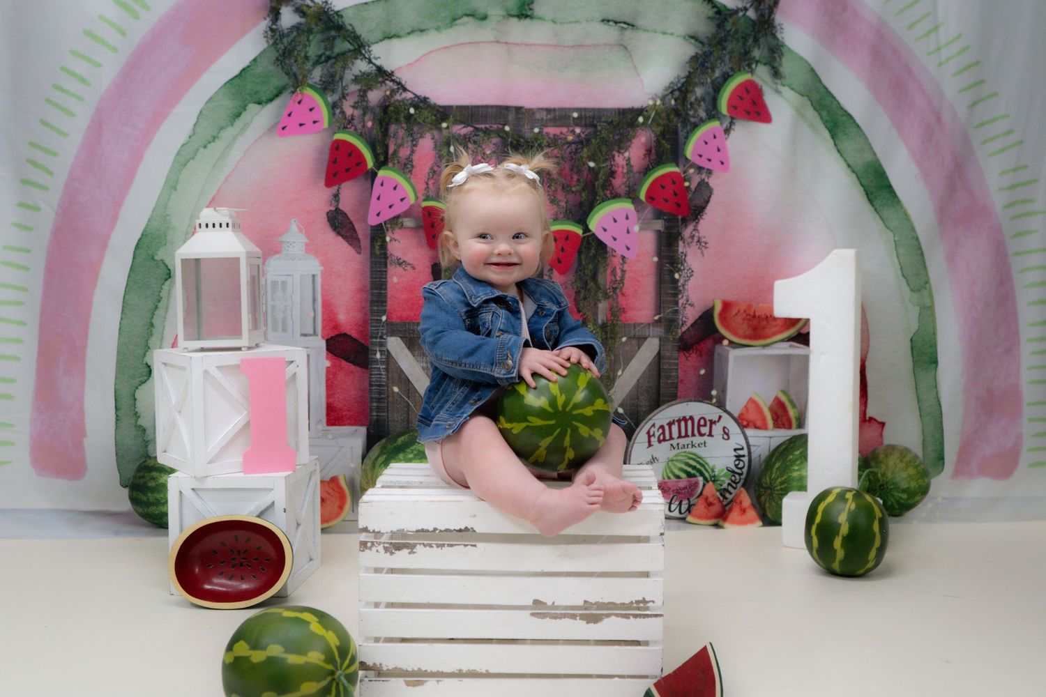 A creative photo series showing watermelon and milk bottles arranged against a pink and gray backdrop with arches.