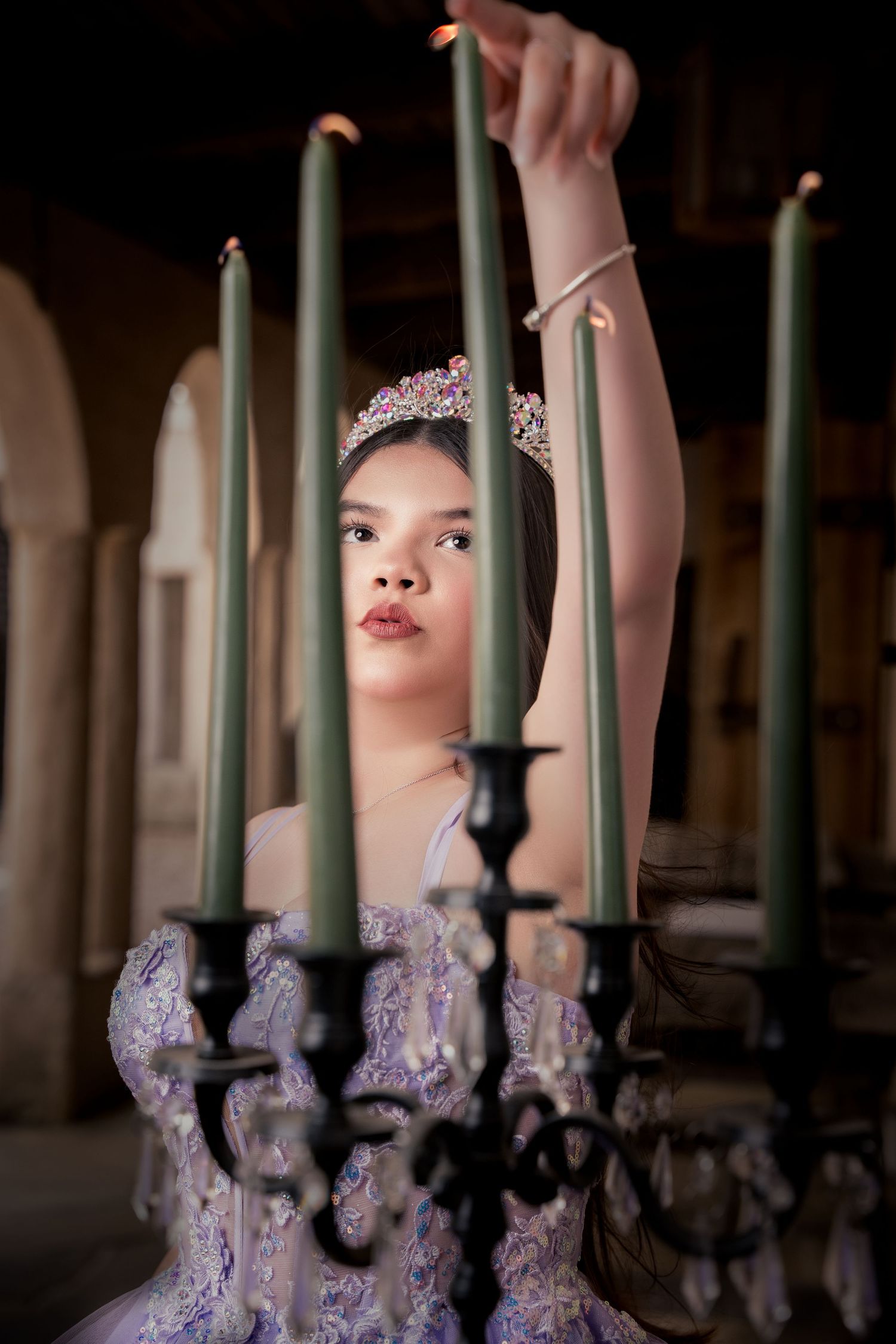 Artistic portrait through iron bars showcasing lavender ball gown details.