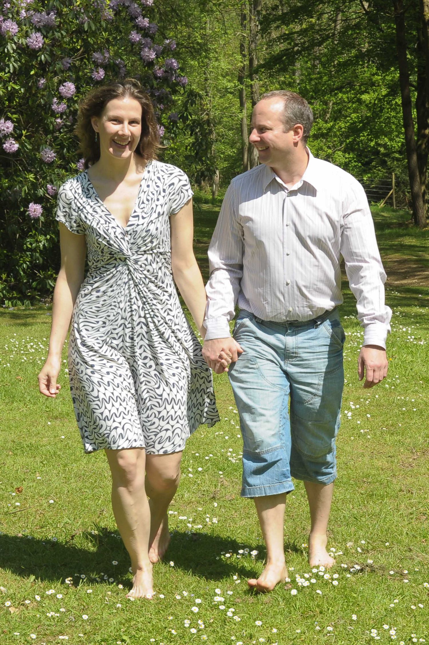 Newley engaged Couple walk hand in hand through woods, High Wycombe. Photography by Abigail's Studio