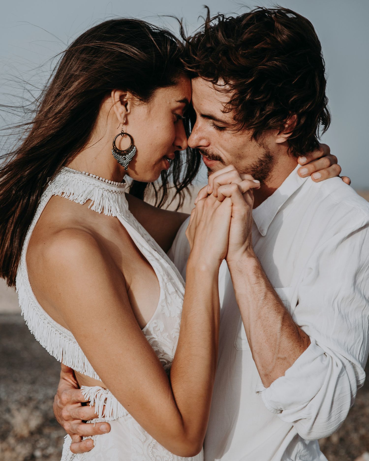 Intimate close-up of a couple sharing a tender moment in monochromatic tones.