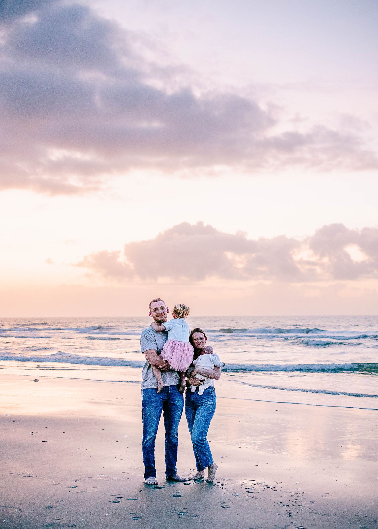 Beach family session with a newborn & toddler at sunrise.