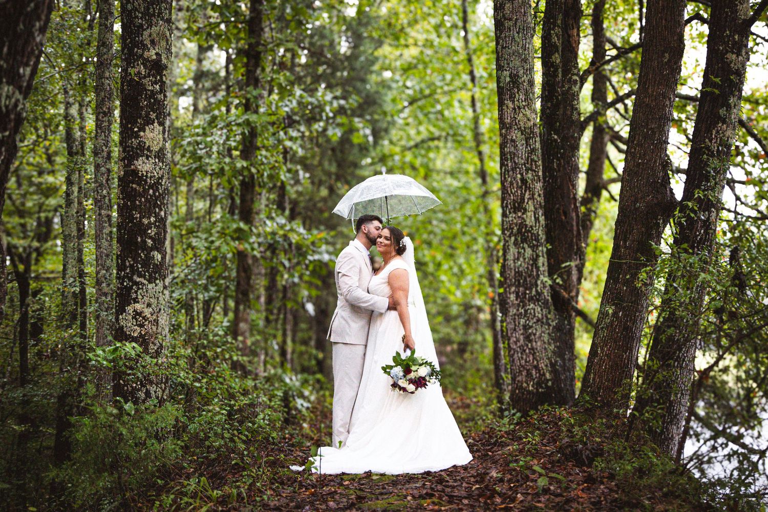 Wedding photos taken in a lush green forest setting.