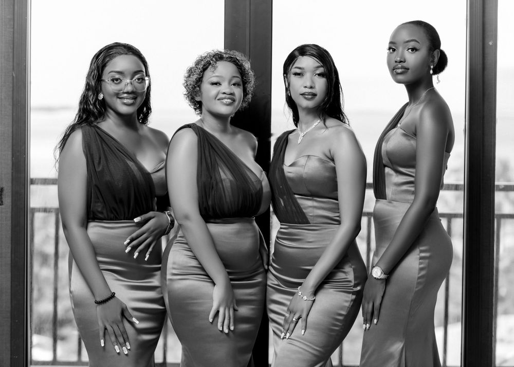 Bridesmaids pose in a stylish group photo wearing coordinated dresses.