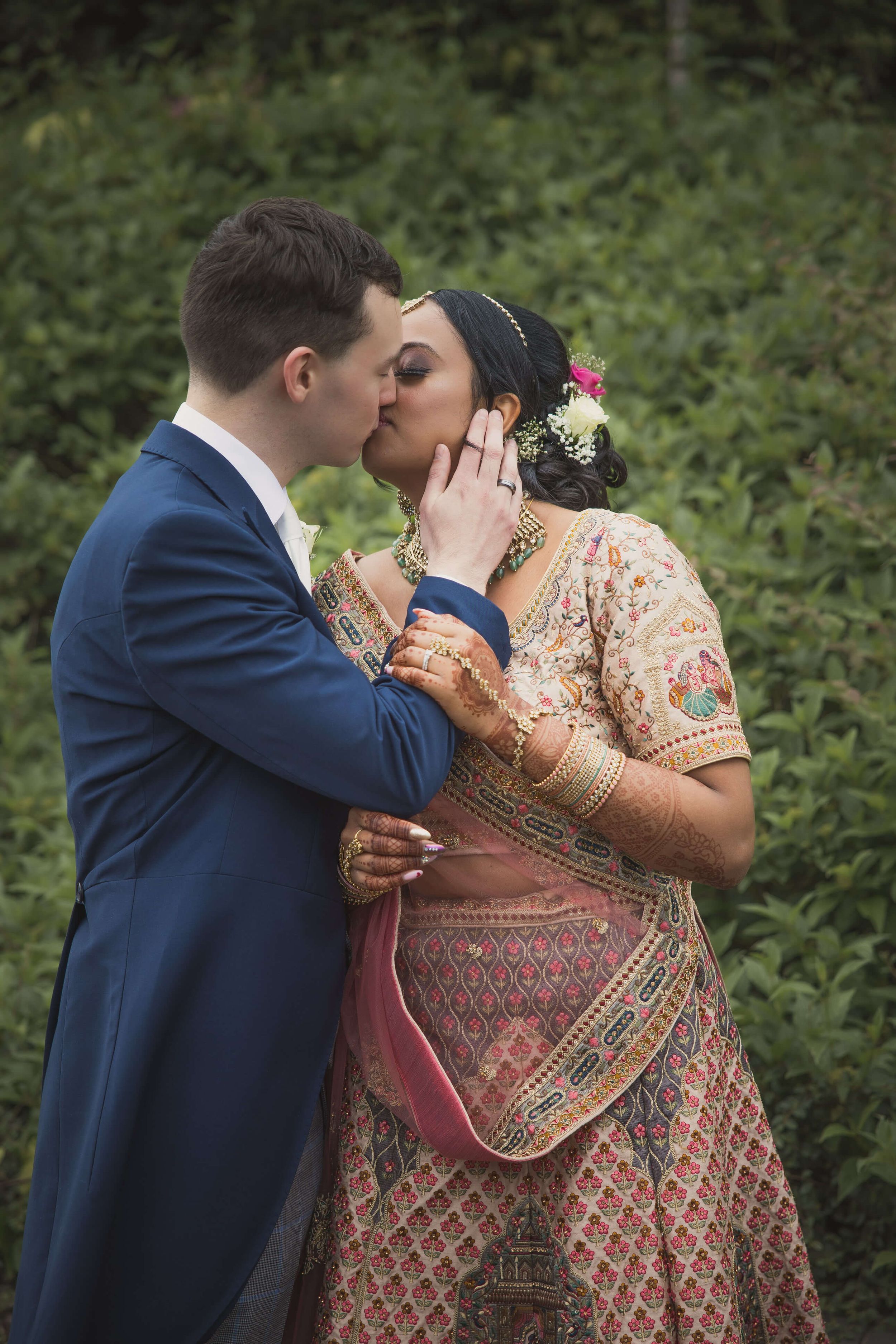 Newly wed expressing their potent emotions through close intimacy, Photographer capturing their timeless moment
