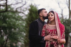Photographed by a camera professional, newlyweds enjoying their first private moment together in Ealing
