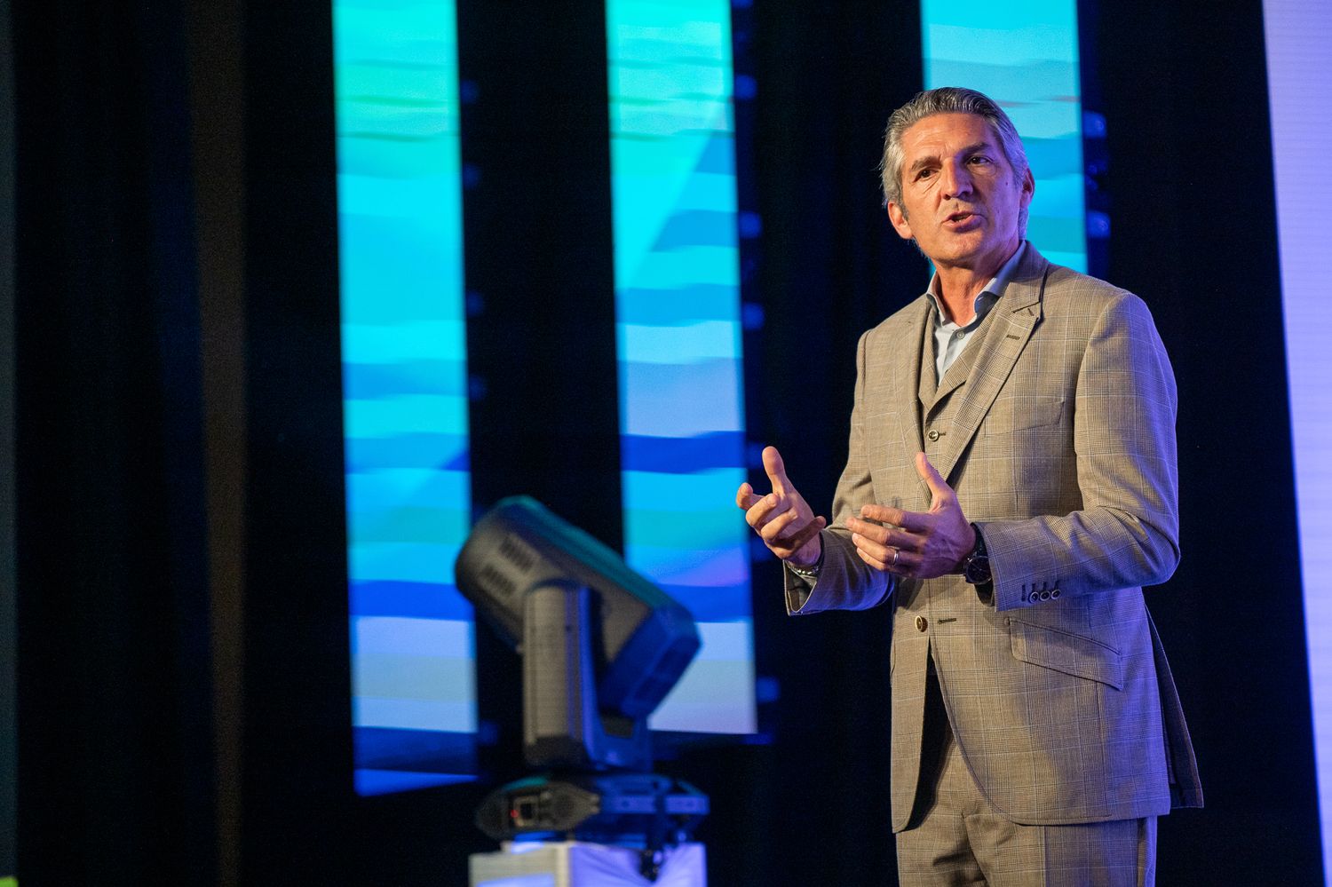 A speaker onstage at the Enablon 2024 conference in Houston, TX.