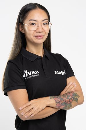 Business professional headshot with confident expression and studio lighting
