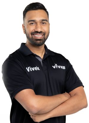 Business professional headshot with confident expression and studio lighting