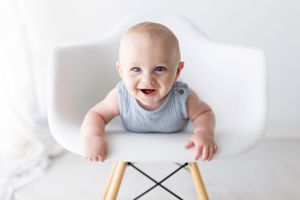 Baby milestone photos on white background with modern minimal styling.