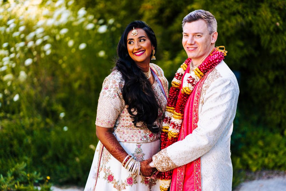 Indian wedding at sefton park palm house, bride and groom posing in the palm house grounds