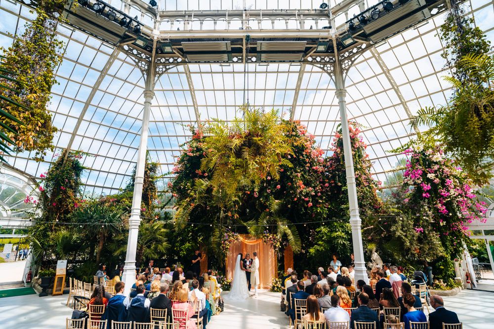 Bride and groom saying their wedding vows in sefton park palm house