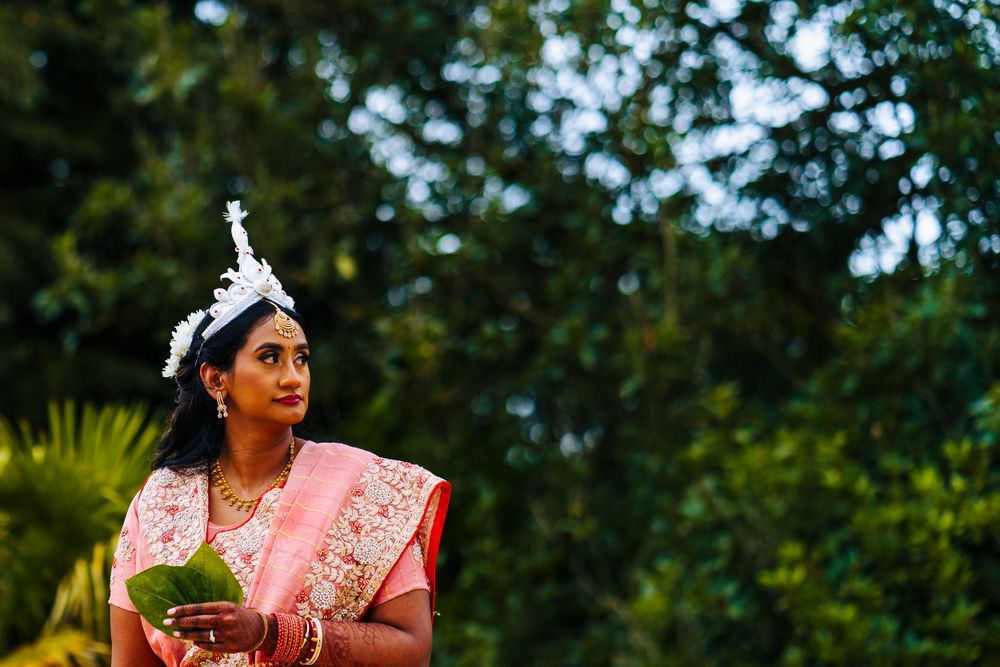 Bride in traditional indian wedding dress outside of sefton park palm house