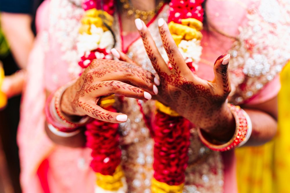 Henna hands during indian wedding ceremony at sefton park palm house