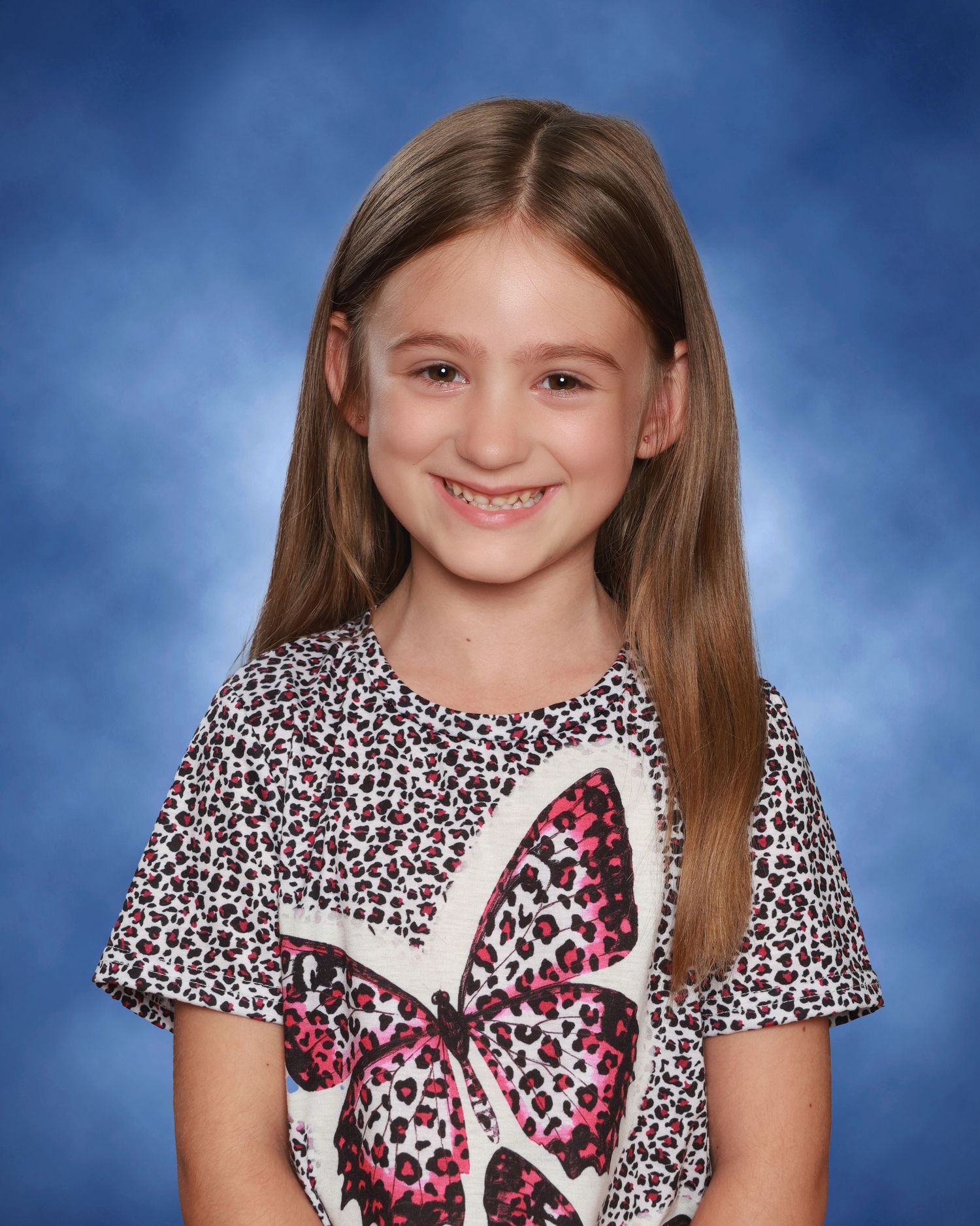 Children smiling naturally during school photo session in Miramichi studio