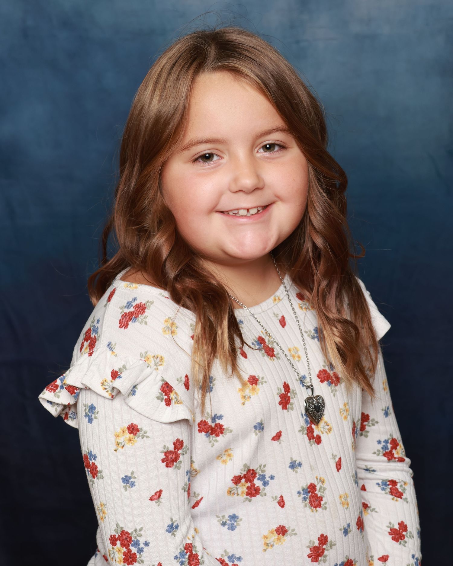 Children smiling naturally during school photo session in Miramichi studio