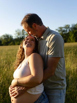 Romantic couple embracing in a sunlit meadow during golden hour, shown in a series of intimate poses.