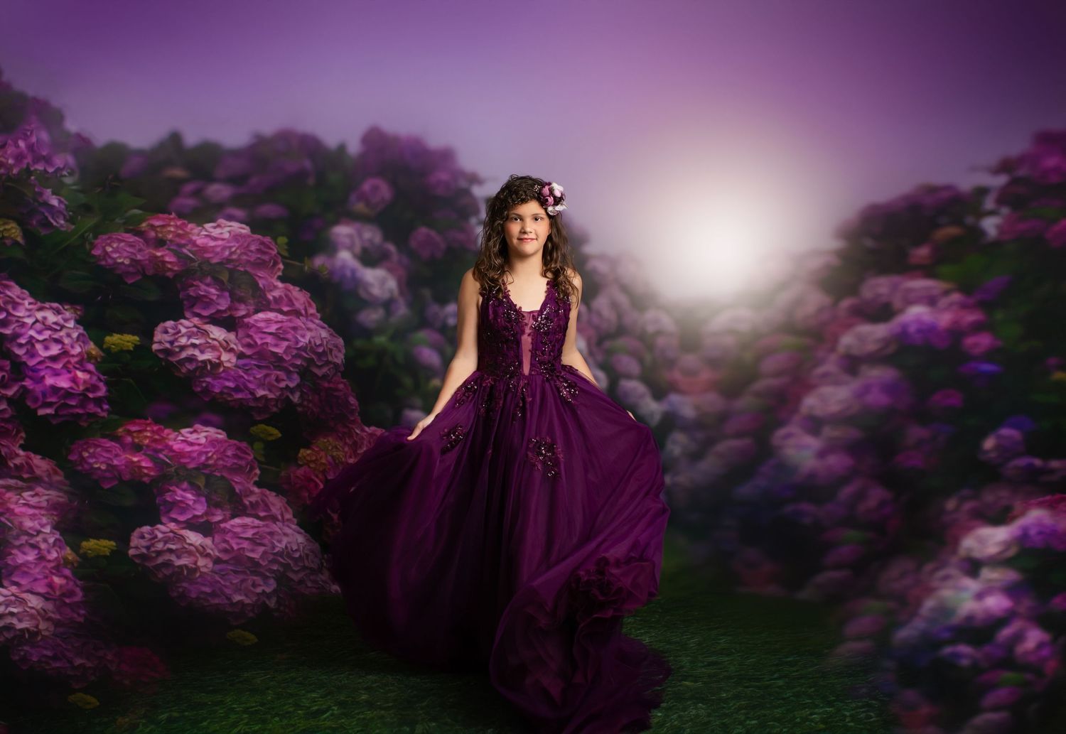 Enchanting portrait in purple flowing dress among blooming flowers at twilight.