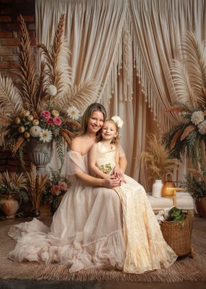 Elegant boho-style photography setup with pampas grass, floral arrangements and draped fabric creating a romantic scene.  Warrenton VA