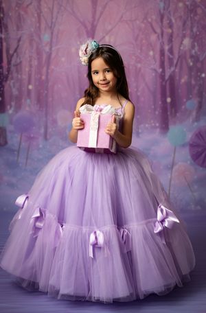 A series of photos showing a lavender tulle dress with bows against a dreamy purple forest backdrop.
