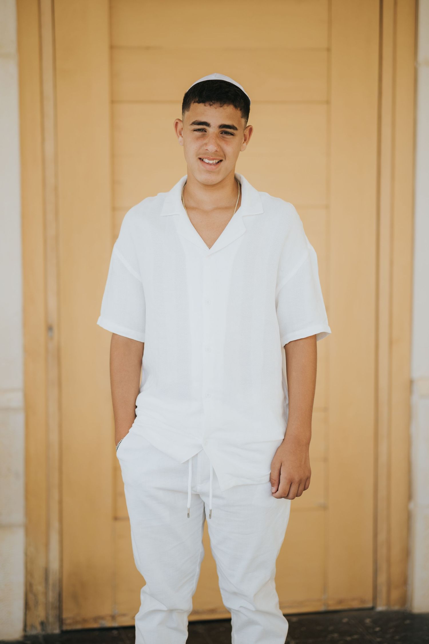 White-walled exterior scene in warm natural lighting.