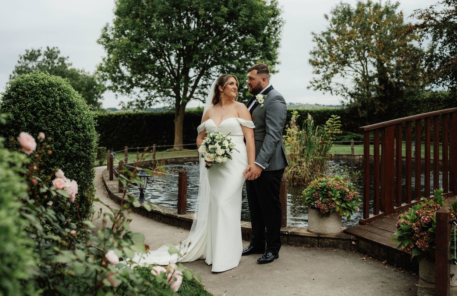 A stunning wedding portrait of a couple sharing a joyful moment, surrounded by elegant decor and a beautiful outdoor set