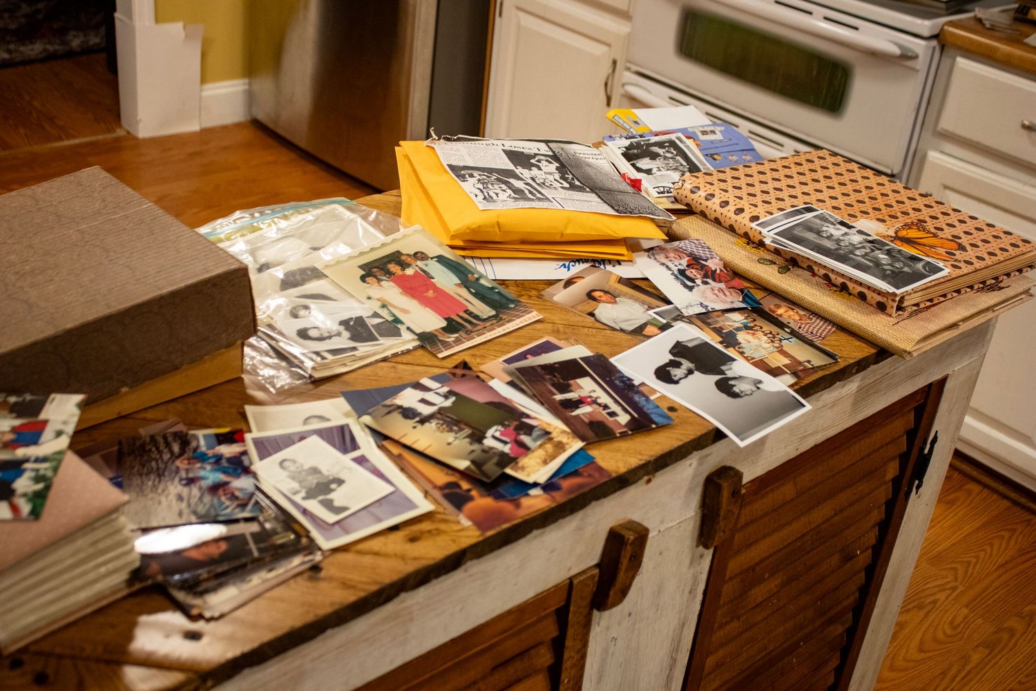 A lot of pictures on the counter