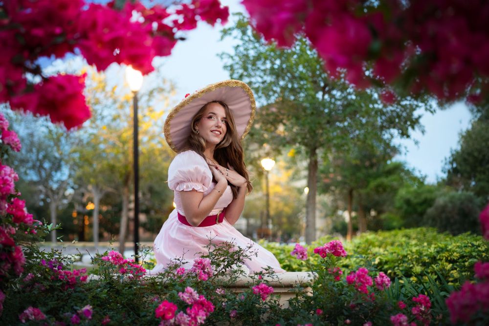 Vibrant Valentine's Day themed Witch cosplay dramatic affects taken after golden hour at Rollins College. Cosplayer focusing on soft poses