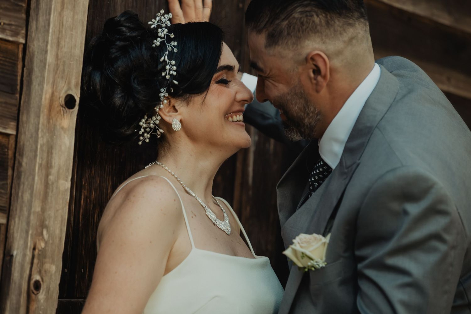 Romantic wedding photography showing tender moments between newlyweds.