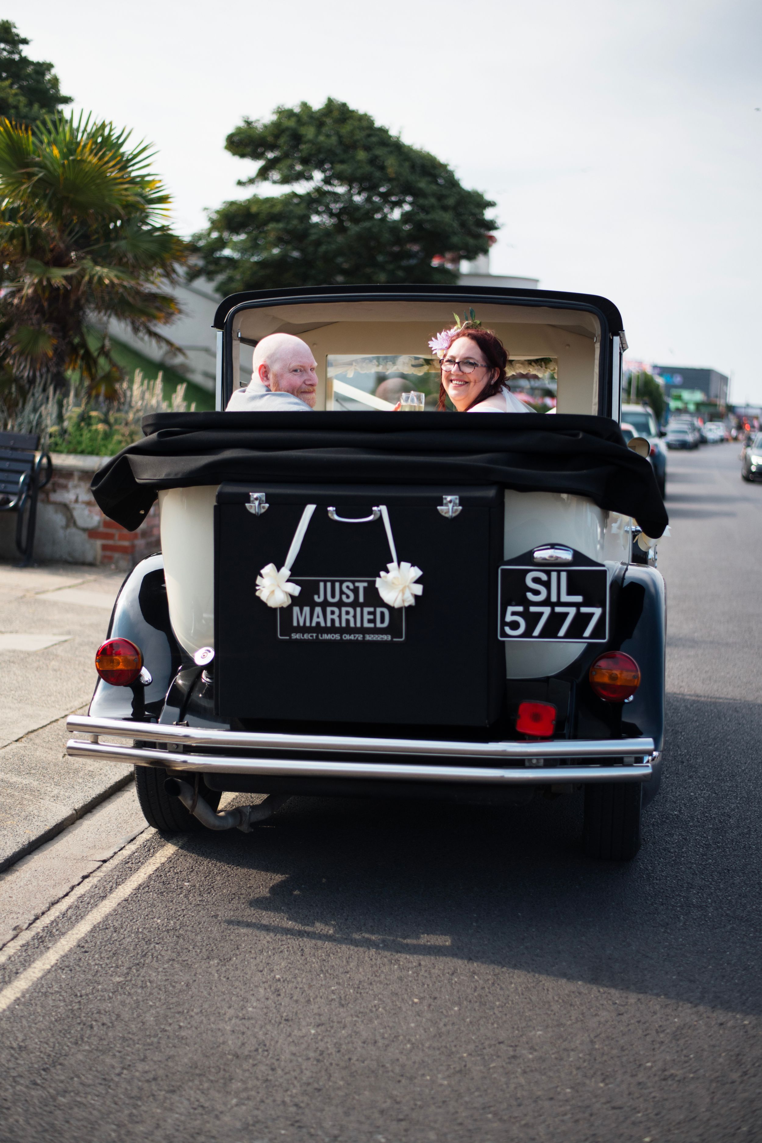 Vintage wedding car with Just Married sign and license plate SIL 5777.