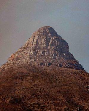 Close-up view of Lion's Head peak in Cape Town against a moody sky.