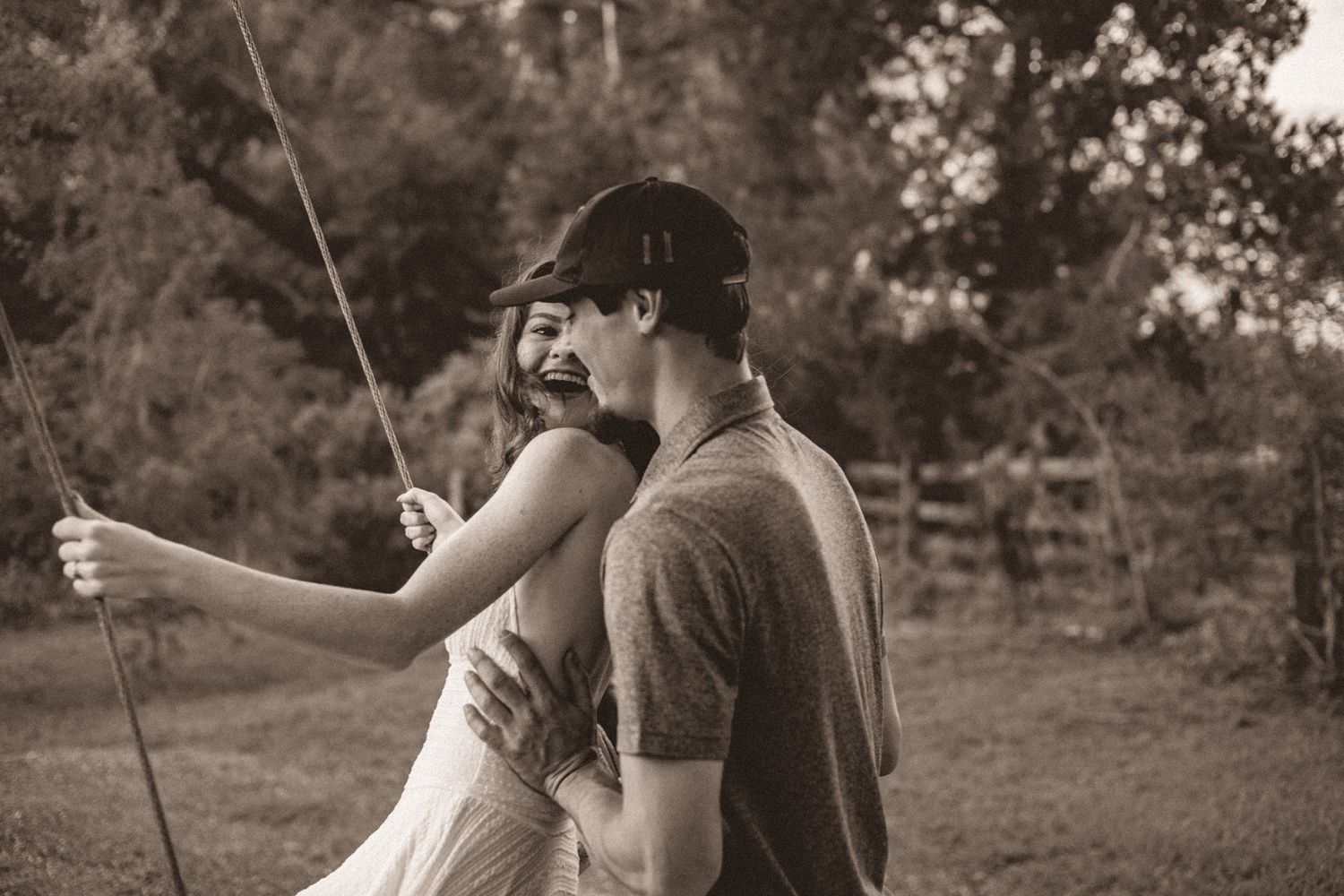 Cute, loving couple, hugging and laughing on a fall, windy day in Live Oak, FL.