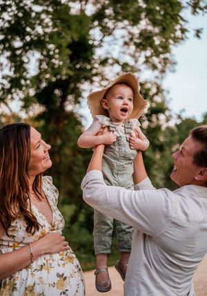 A series of four candid outdoor family photos showing joyful interactions and playful moments in natural lighting.
