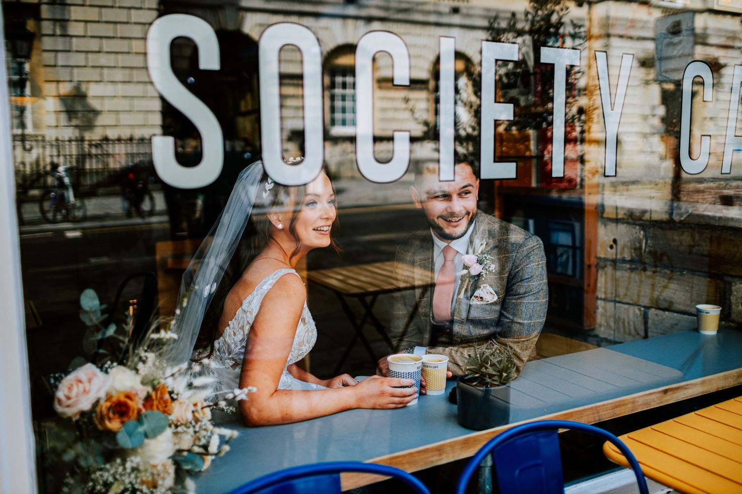 Wedding reception at an outdoor venue with fairy lights and casual seating.
