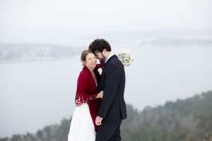 Bride and groom saying their vows on top of Sugar Loaf Mountain in Marquette,MI