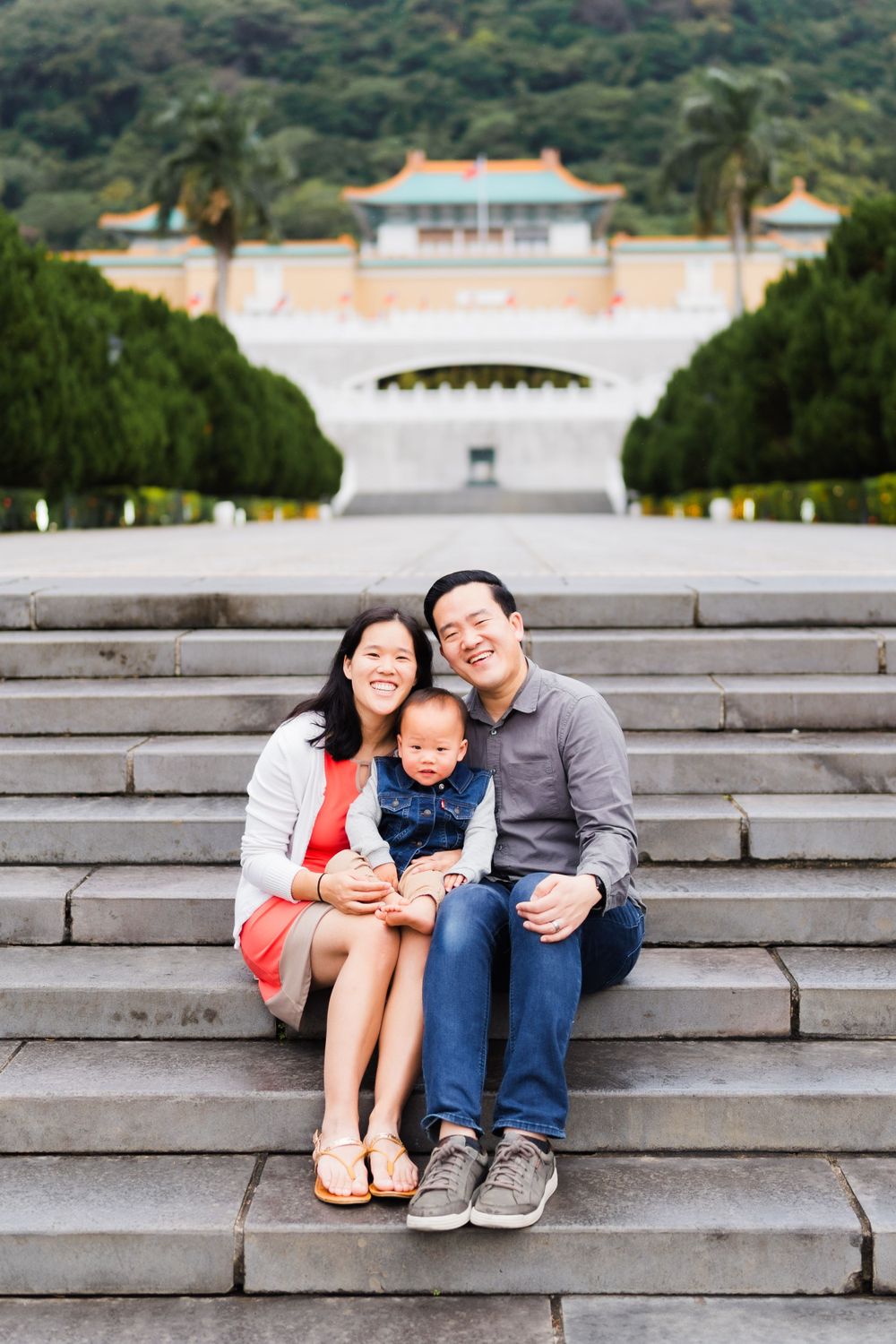 a family posing on the stairs of the National Palace Museum
