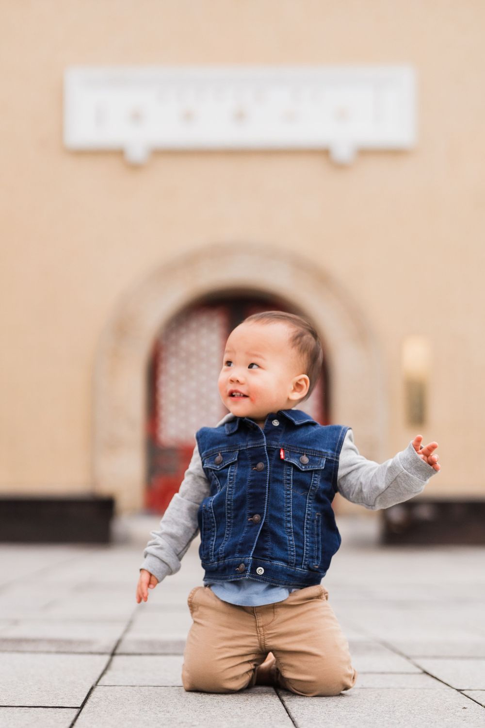 kid smiling in front of National Palace Museum