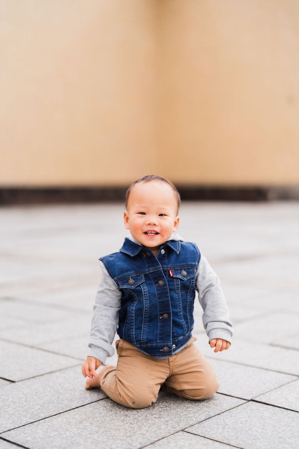 kid smiling in front of National Palace Museum