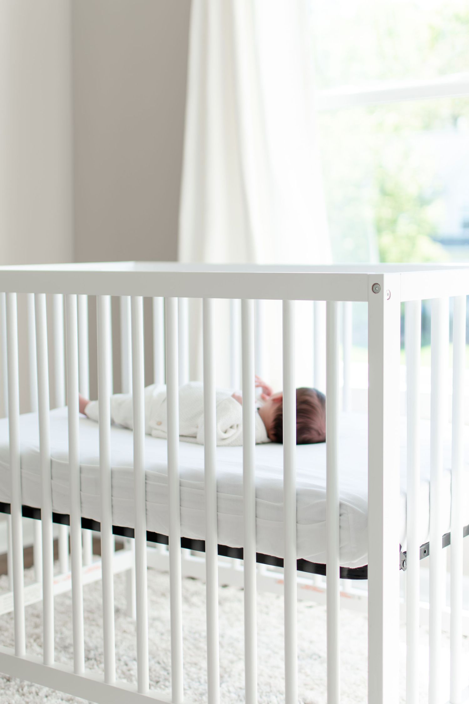 Baby sleeps in her crib in the nursery of their Winston-Salem home.