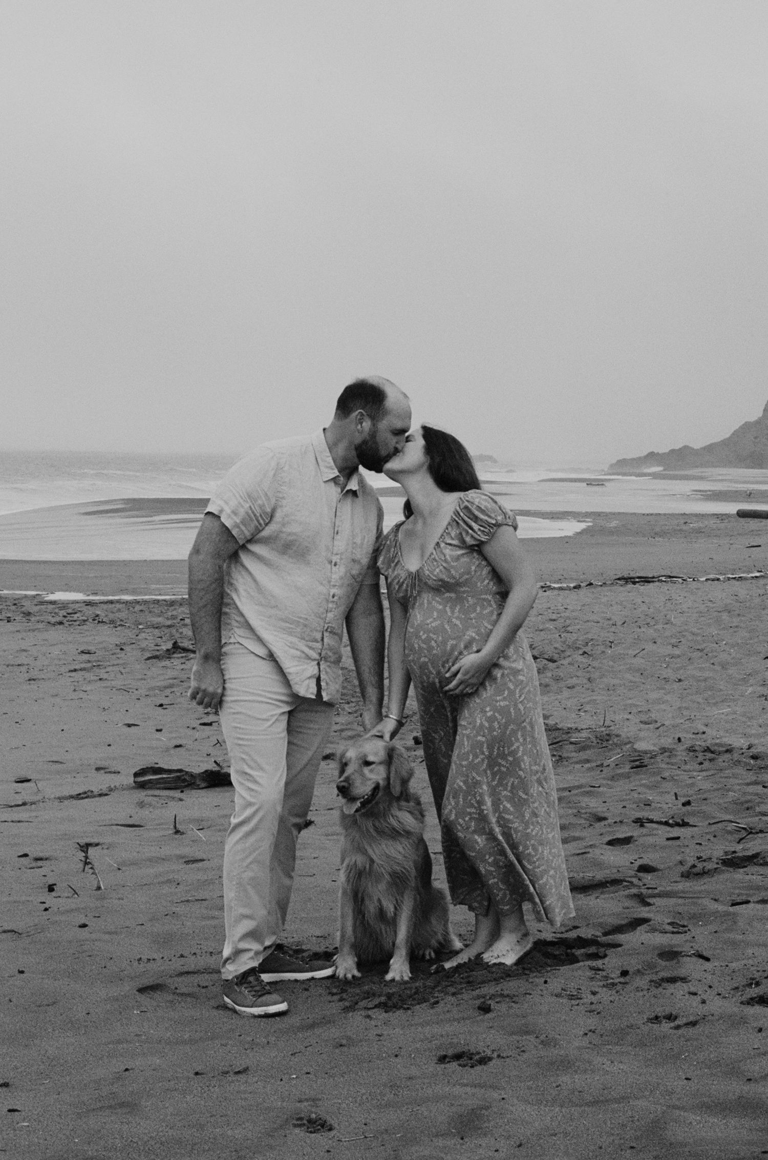 beach maternity session on film with flowing dress and soft sunset light
