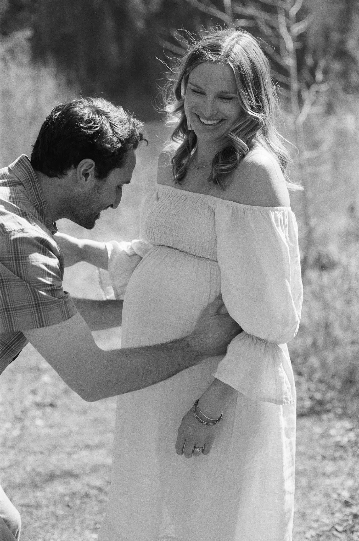 outdoor maternity session on film with flowing dress and soft sunset light
