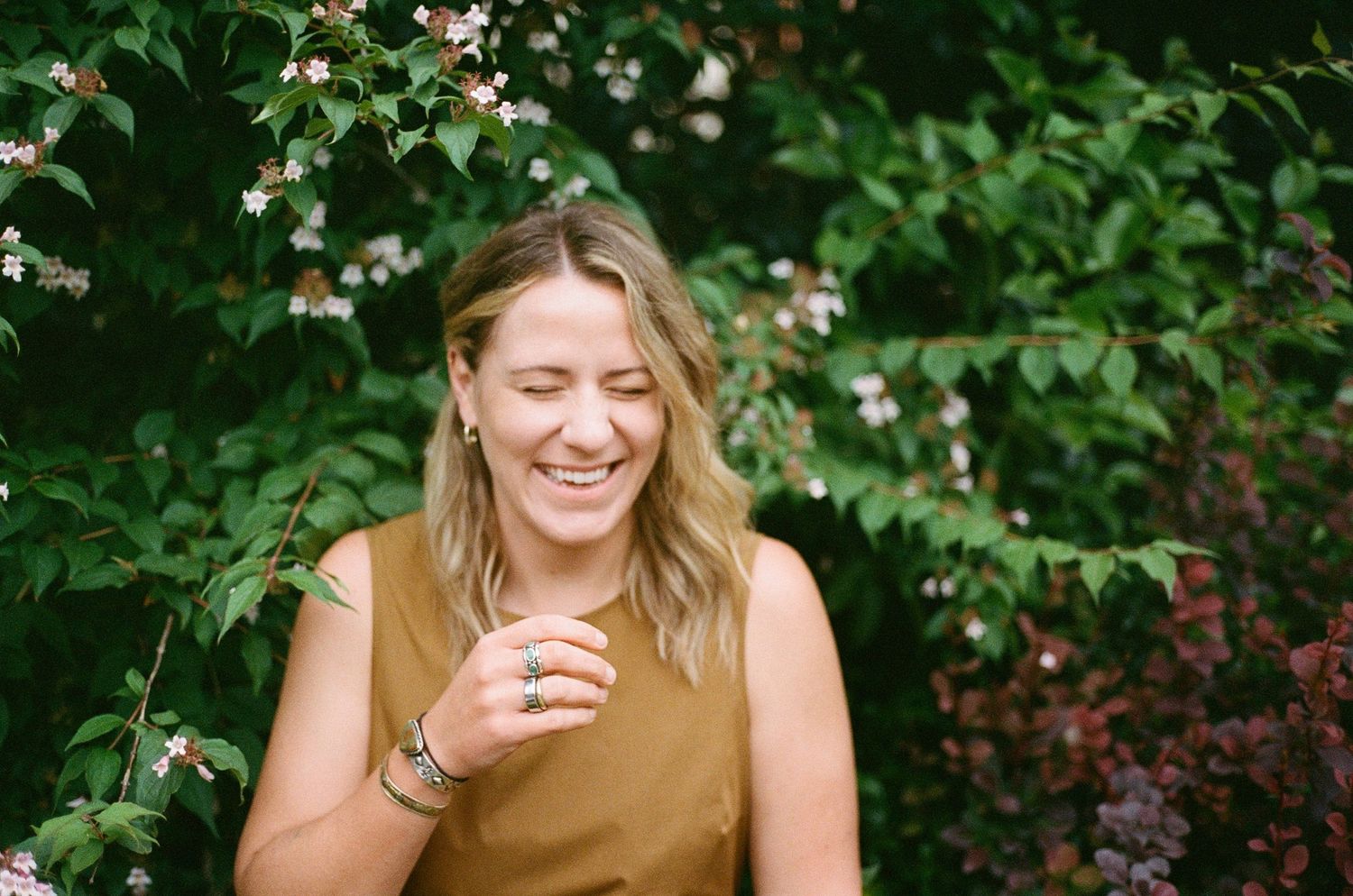 film portrait session in Paris park with lush greenery, soft natural light and romantic, timeless aesthetic